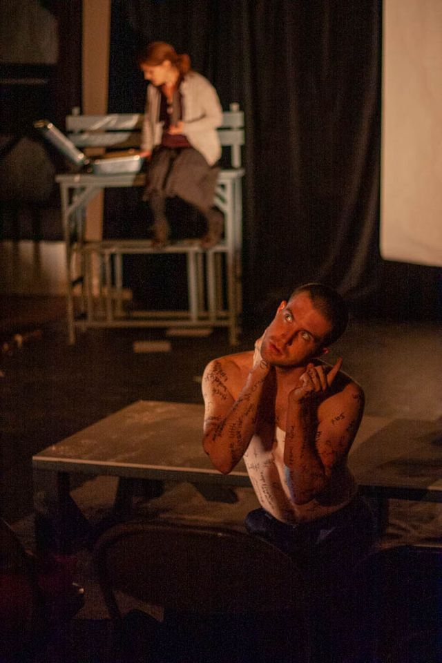 He's posed in the front, she's on a high park bench behind