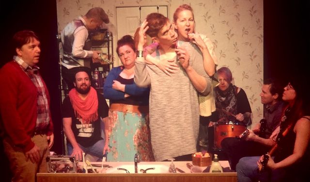 All the characters are crammed in a small bathroom,
with Herman and Sam brushing their teeth,
and Teacup Gorilla playing instruments in the bathtub.
